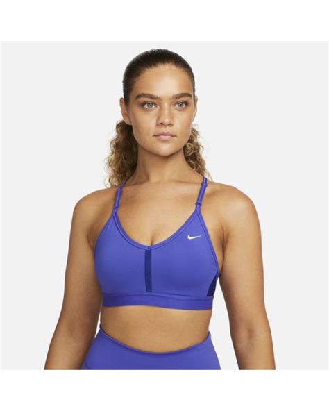 Nike Synthetic Dri Fit Indy Light Support Padded V Neck Sports Bra In Blue Lyst