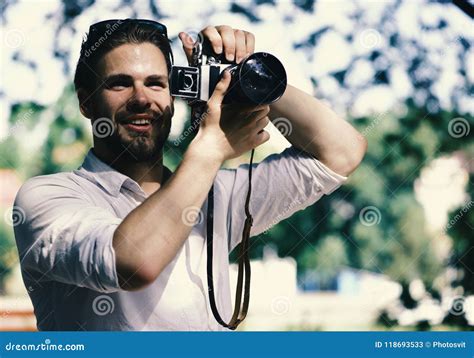 The Photographer Is Working Guy With Smiling Face Takes Picture