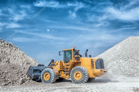 Excavator loader with backhoe works — Stock Photo © artfotoss #53977543