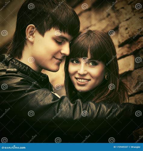 Happy Young Couple in Love Embracing on City Street Stock Image - Image
