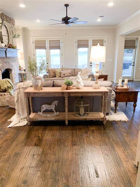 A Living Room Filled With Furniture And A Fire Place