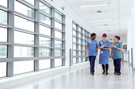 Nurses Walking Along Hospital Corridor Photograph By Lth Nhs Trust