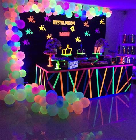 A Party With Neon Lights And Balloons On The Walls Is Ready For Guests