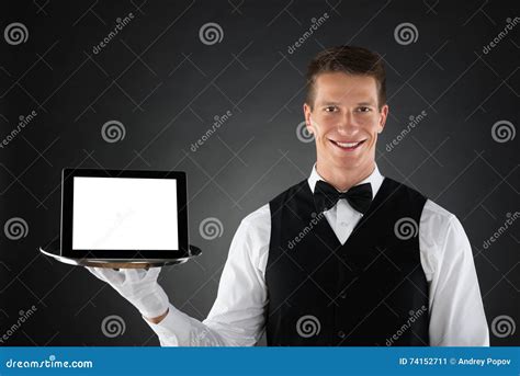 Butler Holding Tray With Digital Tablet Imagen De Archivo Imagen De