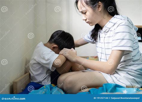 Asian Sister Touching Shoulder Holding Hand Comforting And Caring For