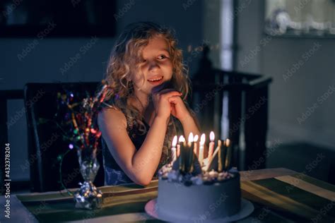 Cute Funny Blonde Girl Blowing Candles On Her Birthday Cake In Dark Room Happy Birthday Party