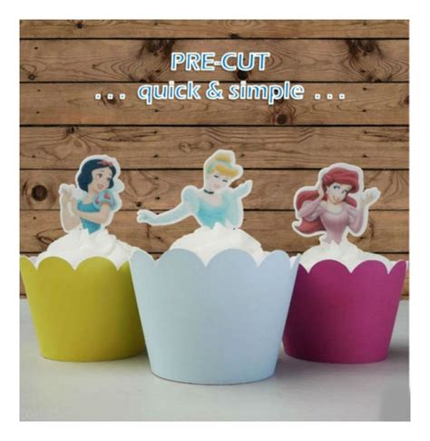 Three Paper Cupcakes With Cutouts Of Princesses On Them And The Words