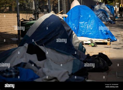 A homeless encampment sits on a street in Downtown Los Angeles ...