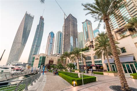 DUBAI - DECEMBER 5, 2016: Sunset in Dubai Marina. Buildings Reflections ...