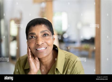 Smiling Mature Woman Looking At Camera Stock Photo Alamy