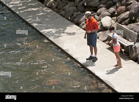 man  girl   stream  sidewalk stock photo alamy