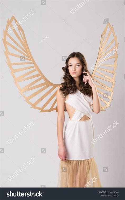 Brunette Girl White Angel Wings Stands Stock Photo Shutterstock