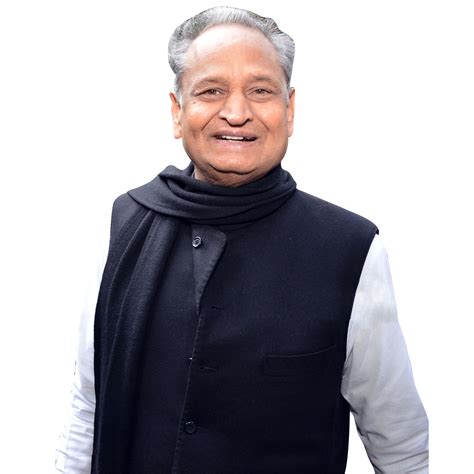 An Older Man Wearing A Black Vest And Scarf