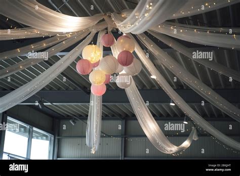 Colorful big paper lanterns hanging from ceiling. Ceiling party light ...