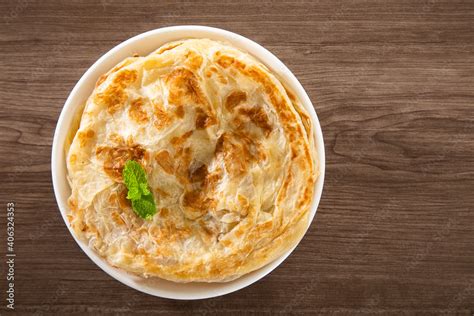 Roti Parata Or Roti Canai With Lamb Curry Sauce Stock Photo Adobe Stock