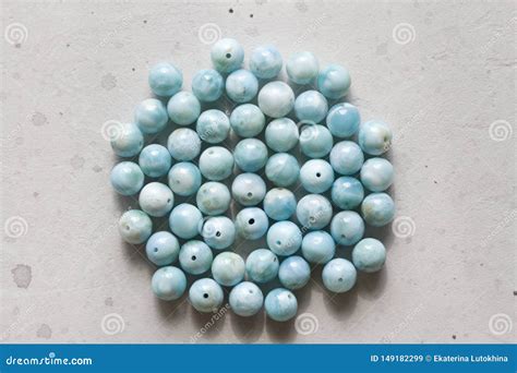 Larimar Stone Natural Stone Larimar Lies On A White Table On A White