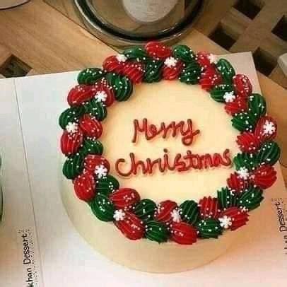 A Christmas Cake With The Words Merry Christmas Written In Frosting And