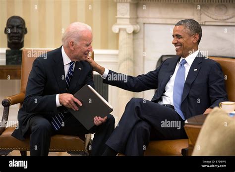 US President Barack Obama and Vice President Joe Biden share a laugh in ...