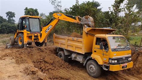 Jcb Backhoe Cutting Soil And Loading In Dump Truck Truck Carrying