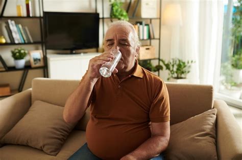 Premium Photo Aged Man Drinking Glass Of Water