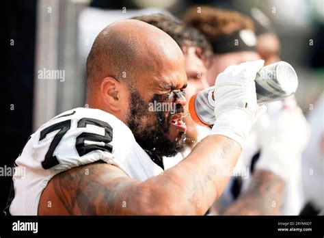 Las Vegas Raiders Guard Jermaine Eluemunor Drinks Water On The Bench