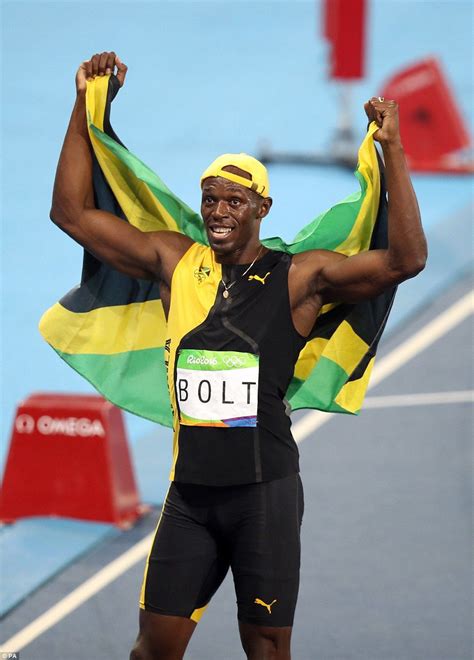 Bolt wrapped himself in the Jamaican flag as he took his victory lap ...