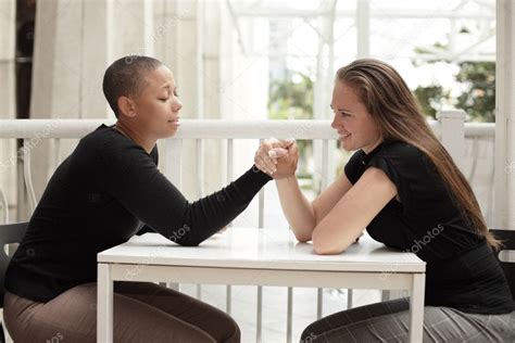 Women arm wrestling — Stock Photo © felixtm #3522921