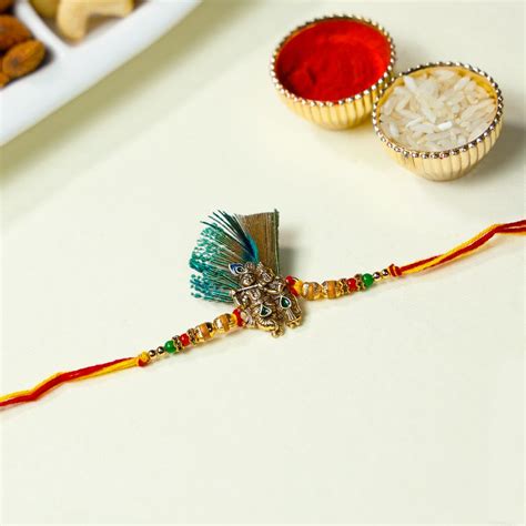 Buy Radha Krishna Feather Rakhi With Dry Fruits Gift Online At