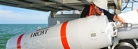 Deckhand Spencer Sharpe Lays Inert Training Mine Shapes For The Rim Of The Pacific Exercise