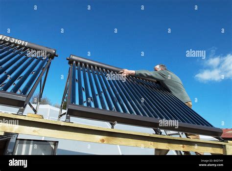 Fitting A Hot Water Solar Panel System Stock Photo Alamy