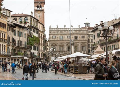 Tourists at the Piazza Delle Erbe in the Historic Center of Verona ...