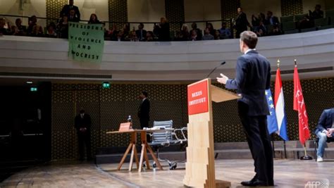 Protesters disrupt Macron speech on Dutch state visit - CNA