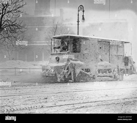 Snow plow removing snow during New York City snowstorm in 1910 Stock ...