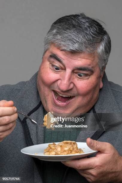 Fat Man Eating Cake Photos And Premium High Res Pictures Getty Images