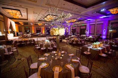 a banquet hall with tables and chairs set up for an event or function ...