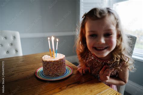 Little girl with birthday cake Stock Photo | Adobe Stock