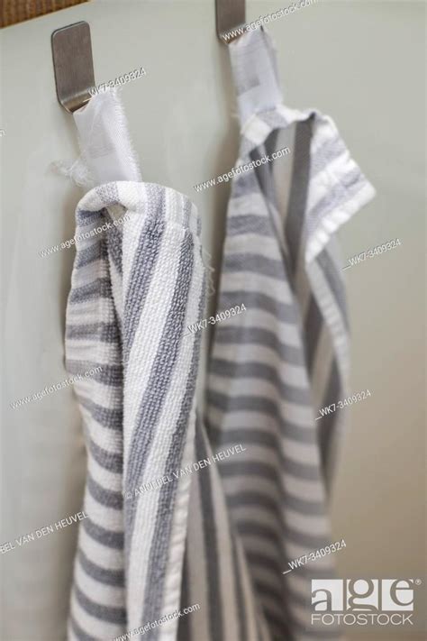 Two kitchen towels hanging on a hooks in a kitchen close-up modern, Stock Photo, Picture And ...