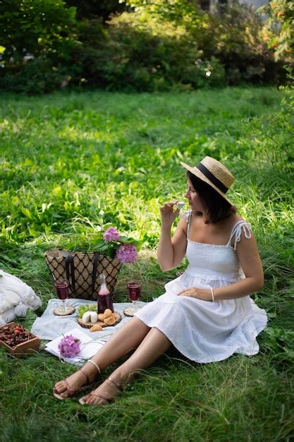 Premium Photo | A girl on a picnic on a green meadow