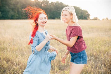 Two Women Having Fun On The Field Stock Photo Image Of Fashion