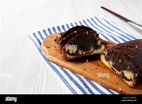 Homemade Chocolate And Vanilla Marble Cake On A Rustic Wooden Board Side View Copy Space Stock