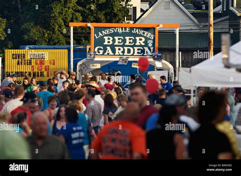 Crowd In Front Of A Beer Garden Sign At A Small Town Festival In