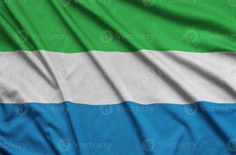 Sierra Leone Flag Is Depicted On A Sports Cloth Fabric With Many Folds