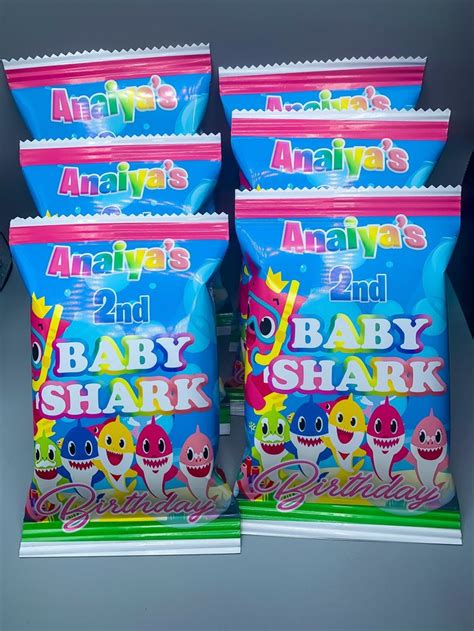 three bags of baby shark snacks sitting on top of each other