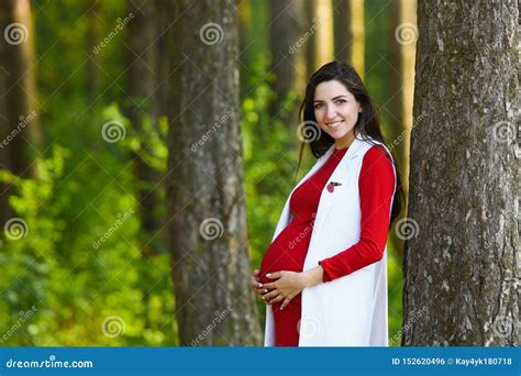 Pregnant Girl In Red Dress Portrait Of Beautiful Pregnant Woman In Red