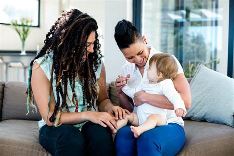 Lesbian Couple Playing With Their Baby Stock Photo Image Of Cheerful Focus 66972846