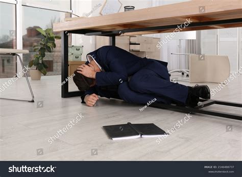 Scared Man Hiding Under Office Desk Stock Photo 2146488737 Shutterstock