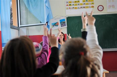 happy teacher in school classroom 11916182 Stock Photo at Vecteezy