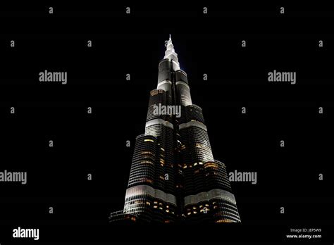 Illuminated skyscraper at night Stock Photo - Alamy 