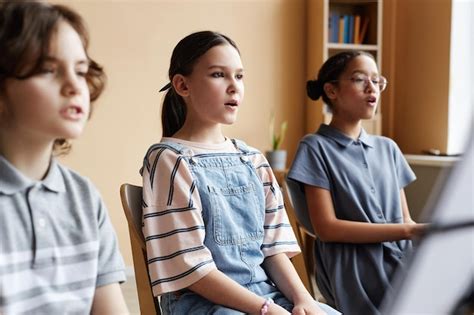 Premium Photo Choir Of Children Singing In Class