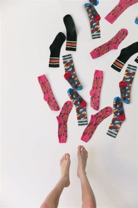 Modern bright socks and bare feet · Free Stock Photo